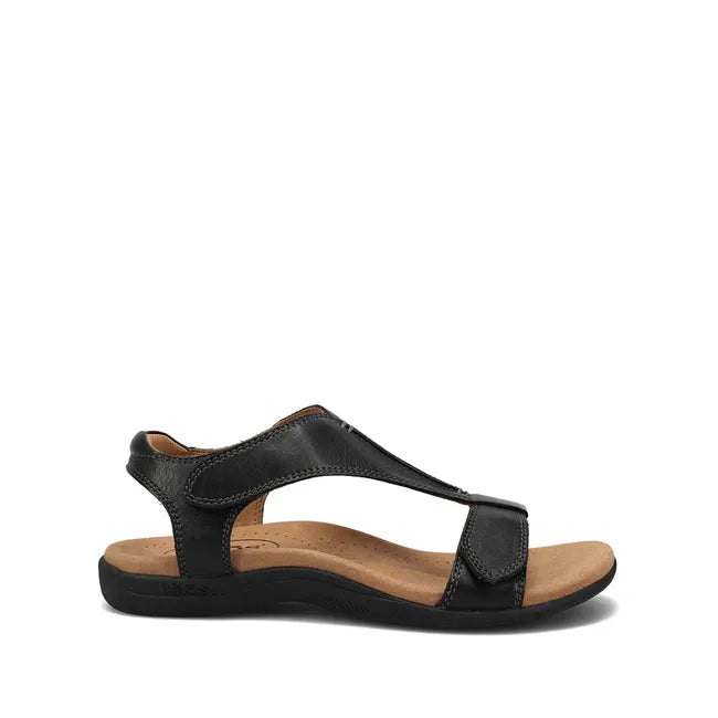 Lateral side of Women's Taos The Show Sandal in black leather with velcro straps