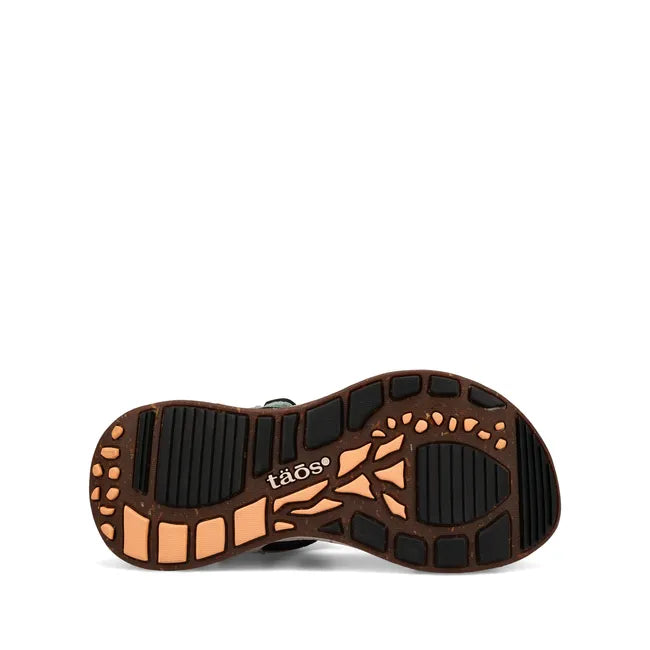 Rugged black and orange sole of Women's Taos Super Side Sandal in Retro Emboss Multi
