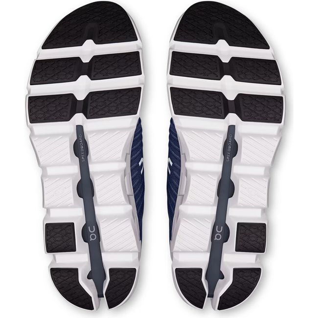 Soles of Men's On Running Cloudswift 4 Running Shoes in Navy Ink blue with hollow cloud pods