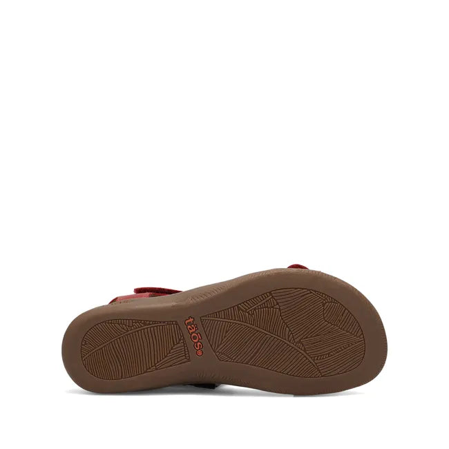 Brown sole of Women's Taos The Show Sandal in red leather upper