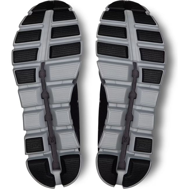 Soles of Men&#39;s On Running Cloud 5 Push Running Shoe in Rock Black with hollow cloud pods