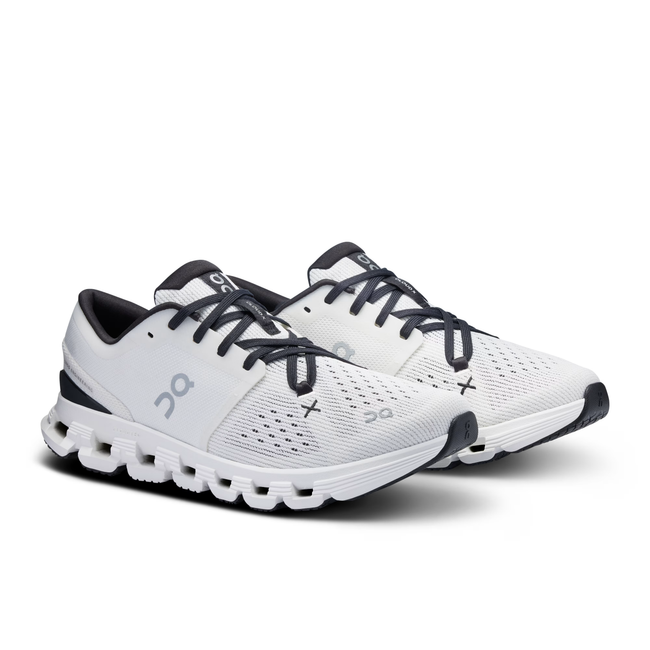 Angled pair of On Running Women's Cloud X 4 Cross Training Shoe in Ivory White