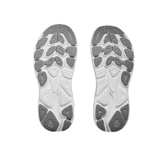 Soles of Hoka Women's Clifton 10 Running Shoe in Stellar Grey