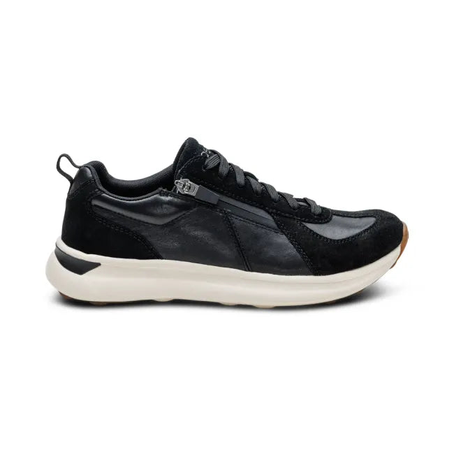 Side of of Aetrex Women's Elise Sneaker in Black with side zipper