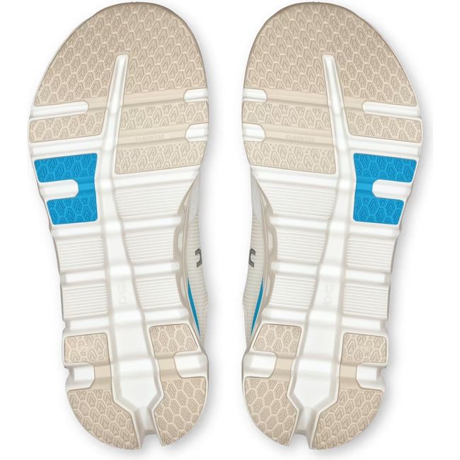 Soles of On Running Women's Cloudrunner 2 Running Shoes in white horizon