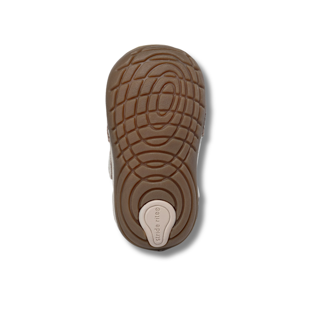 Brown sole of Stride Rite Kids' Soft Motion Jules Sneaker in Toffee Beige