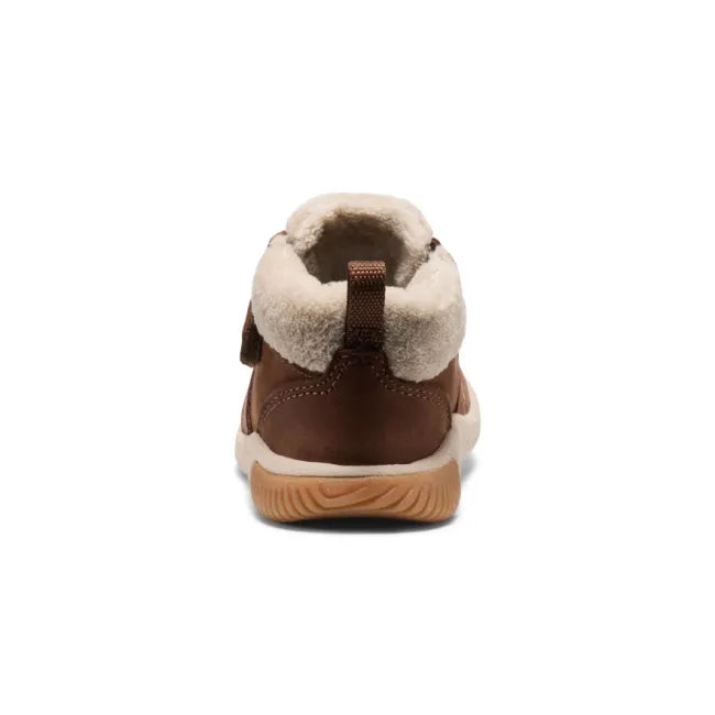 Heel of KEEN Toddlers’ KNX Middie Boot in brown with white faux wool