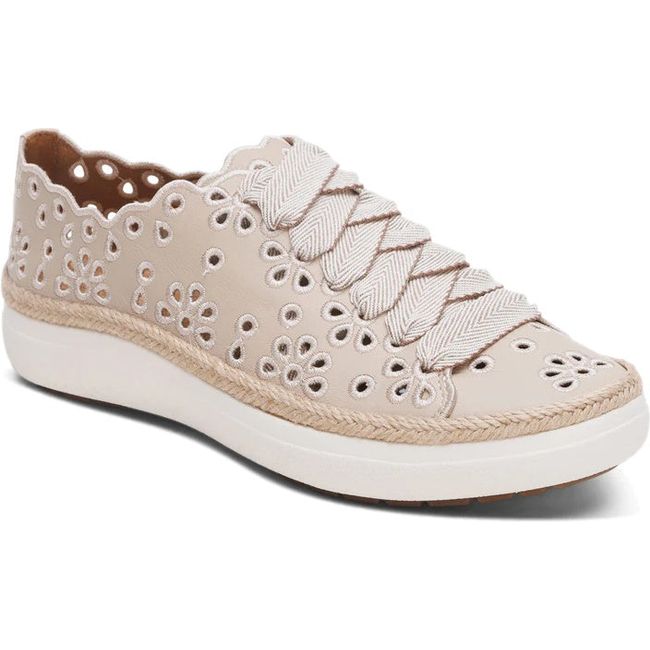 Front angled view of Women's Aetrex Charlotte Arch Support Sneaker in Tan leather with cutouts