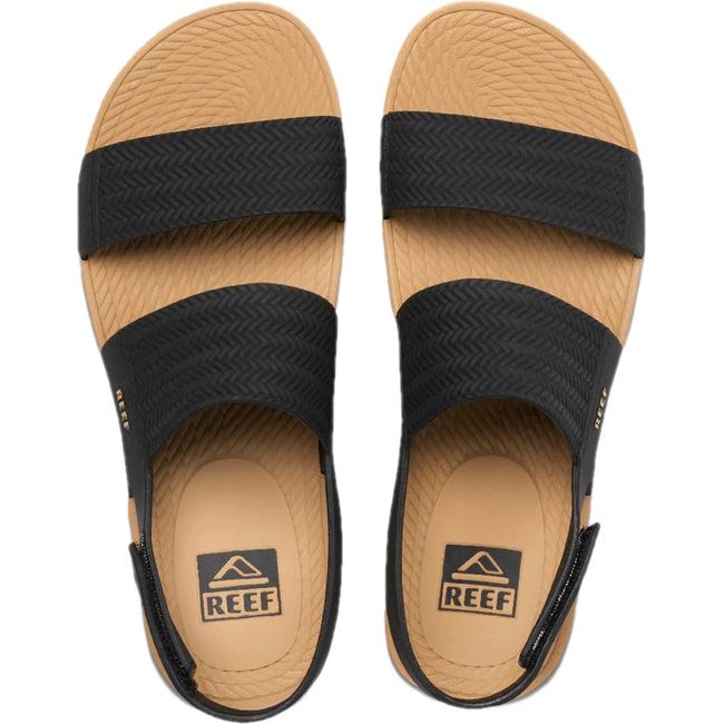 Top down view of Women's Reef Water Vista Sandals in black and tan with velcro backstrap