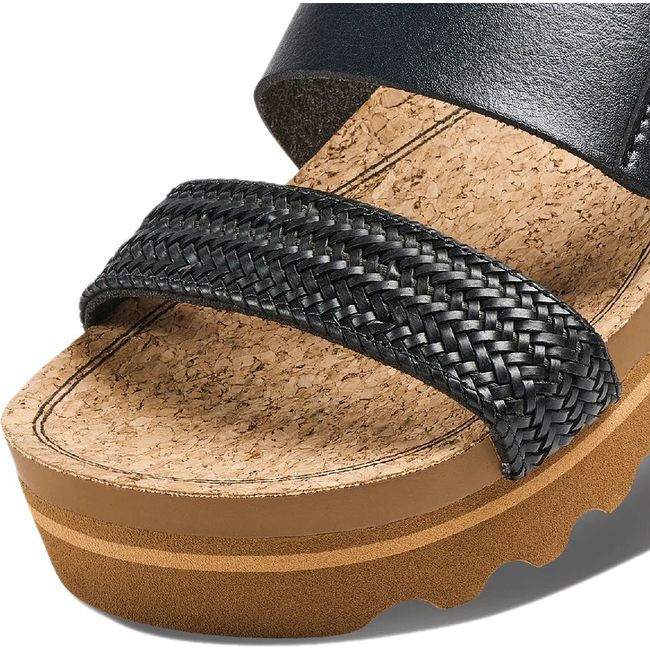 Close up of Women's Reef Cushion Vista Hi Platform Slide in Black Braid vegan leather