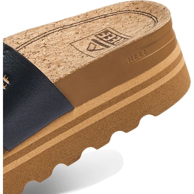 Heel close up of Womens Reef Cushion Vista Hi Platform Slide in Black Braid leather and tan sole