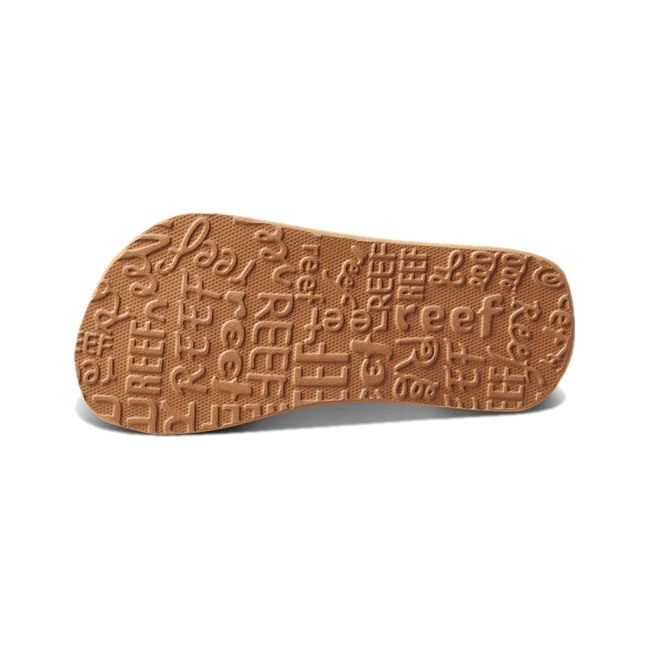 Sole of Kids' Reef Ahi Flip Flop with Daisy floral design and tan tread