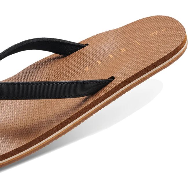 Heel close up of Women's Reef Solana Flip Flop Sandal in Black and Tan