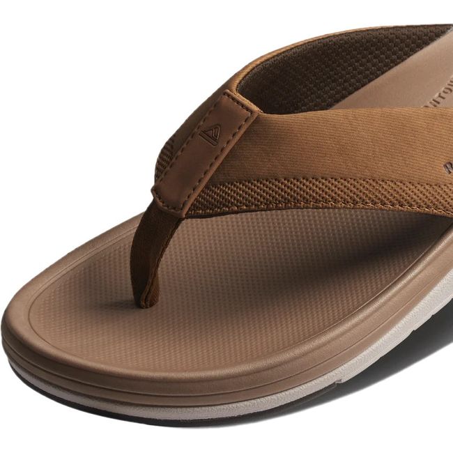 Front close up of Men's Reef Cushion Norte Flip Flop in tan showing strap and cushioned footbed