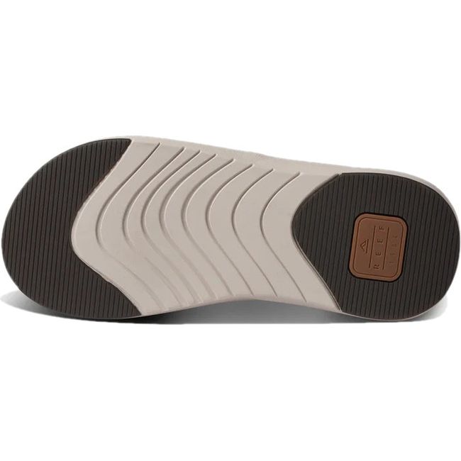 Sole of Men's Reef Cushion Norte Flip Flop in tan with brown and beige tread