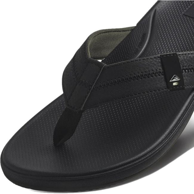 Close up view of the strap of Men's Reef Cushion Phantom 2.0 Flip Flop in black
