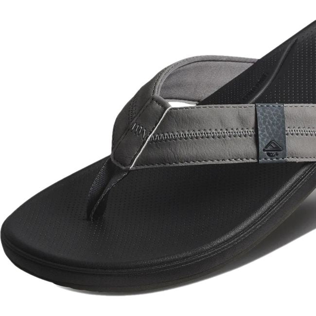Close up view of the strap of Men's Reef Cushion Phantom 2.0 Flip Flop in shadded grey