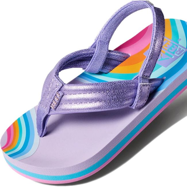 Close up of Kids' Reef Little Ahi Sandal in Candyland purple with rainbow patterns and backstrap