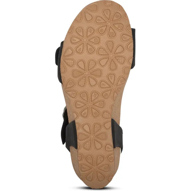 Tan sole of Women's Aetrex Lexa Arch Support Wedge Sandal in black