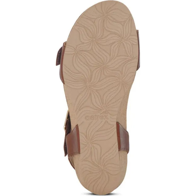 Beige sole of Women's Aetrex Lexa Arch Support Wedge Sandal in walnut brown upper
