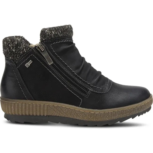 Lateral of Womens Spring Step Cleora Boot in black leather with a side zipper and faux shearling