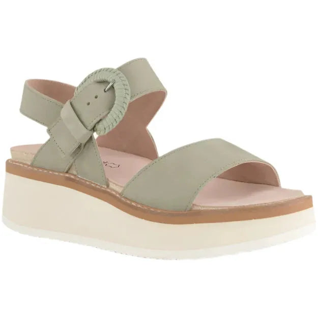 Lateral side angled view of the Sage Nubuck Naot Women's Crepe Platform Sandal featuring a 2.2-inch white EVA platform sole, stylish buckle closure, and anatomic cork and latex footbed wrapped in suede