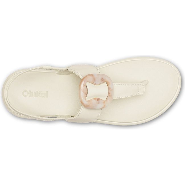 Top down view of Women's Olukai La'i T-Bar Sandal in white sand with backstrap