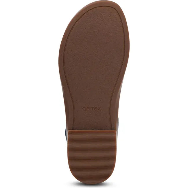 Brown sole of Women's Aetrex Claire Arch Support Sandal in Navy and blue upper
