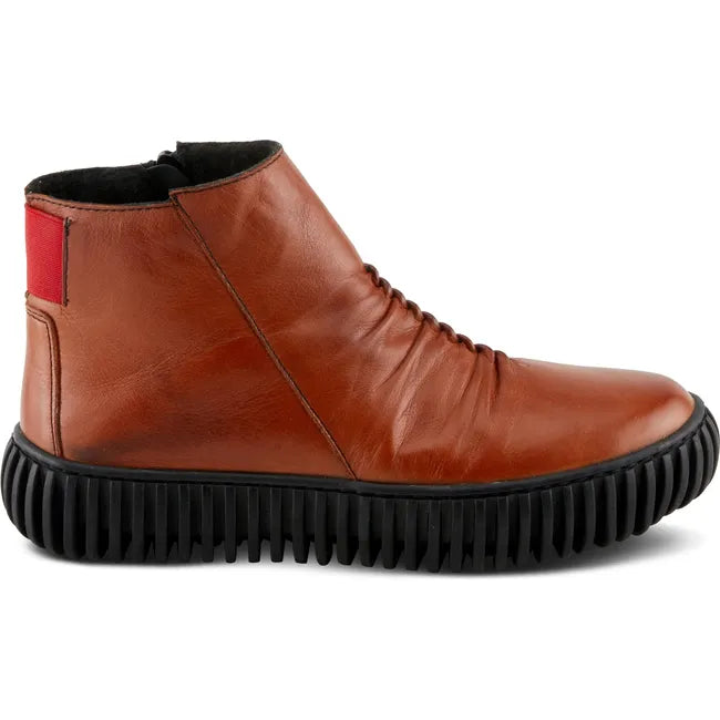 Lateral side of Women's Spring Step Holman Boot in cognac leather with a chunk black sole