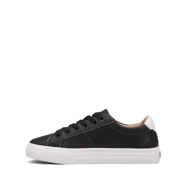 Medial side of Women's Taos Heart &amp; Soul Lux Sneaker in Black leather with white midsole