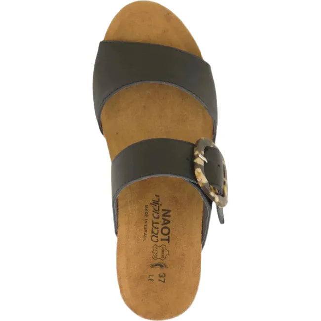 Top view of Naot Women's Kingdom Wedge Sandal in black, featuring an oversized buckle and a suede-wrapped anatomic cork and latex footbed.