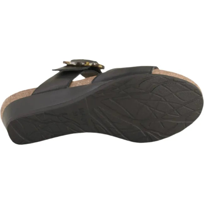 Sole view of Naot Women's Kingdom Wedge Sandal in black, featuring a durable shallow tread polyurethane outsole.