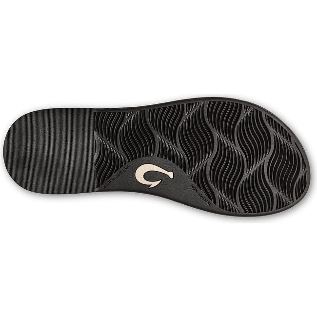 Sole of Women's Olukai Tiare Wrap Sandal in Black leather