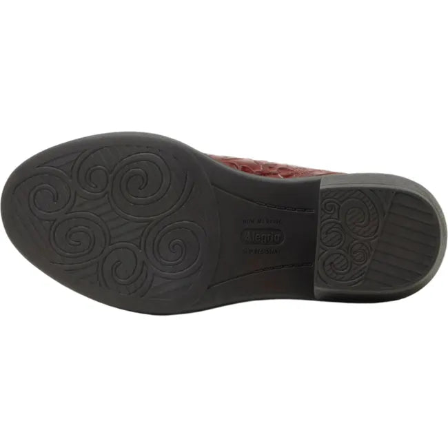 Sole of Women's Alegria Michy Mules in Loretta Roja red floral embossed leather with a brown outsole