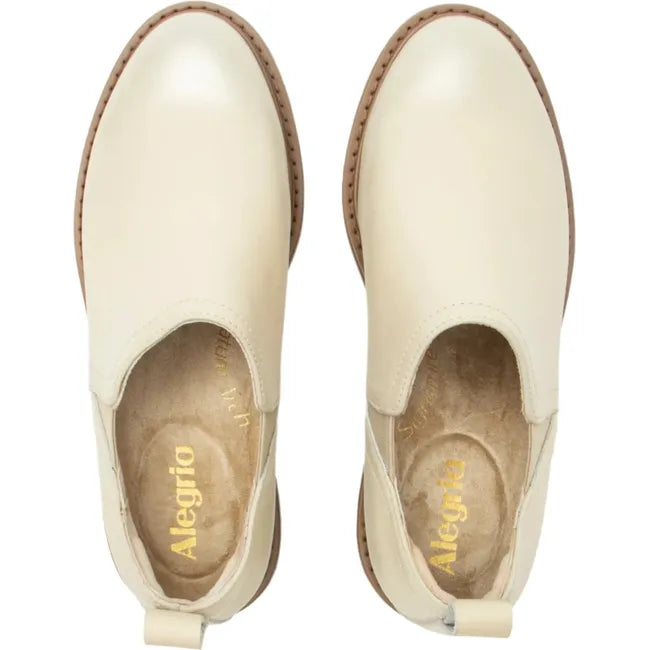 Top down view of Women's Alegria Merle Ankle Boots in gold cream leather upper with slip on entry