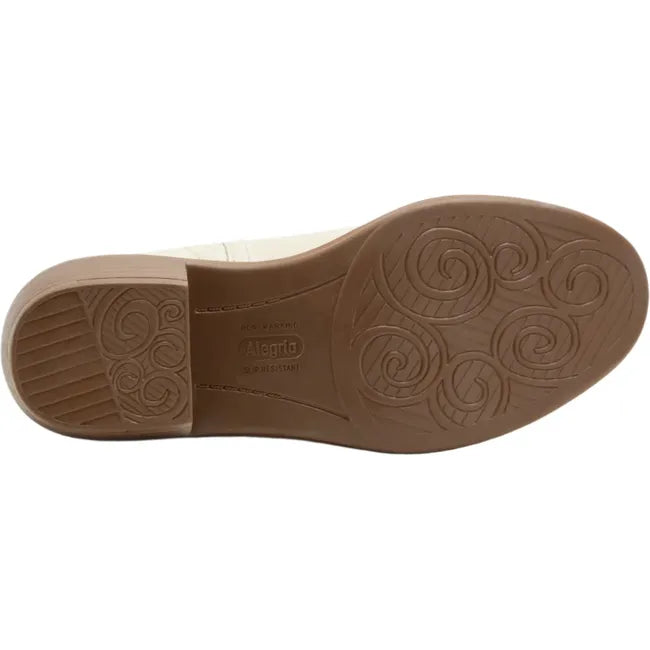 Sole of Women's Alegria Merle Ankle Boots in gold cream leather upper with brown slip resistant sole
