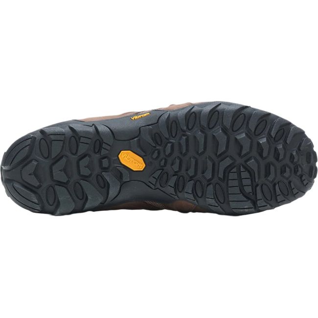 A bottom view of the brown and black Merrell Men's Chameleon 8 Stretch Hiking Shoe showcasing the rugged sole. The shoe features a Vibram® XS Trek Evo outsole with deep 5mm lugs designed for traction and flexibility, with the sole view highlighting the tread pattern and durable construction for trail use.