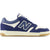 Lateral side of Unisex New Balance 480 sneakers in navy blue and off-white with a gum sole.