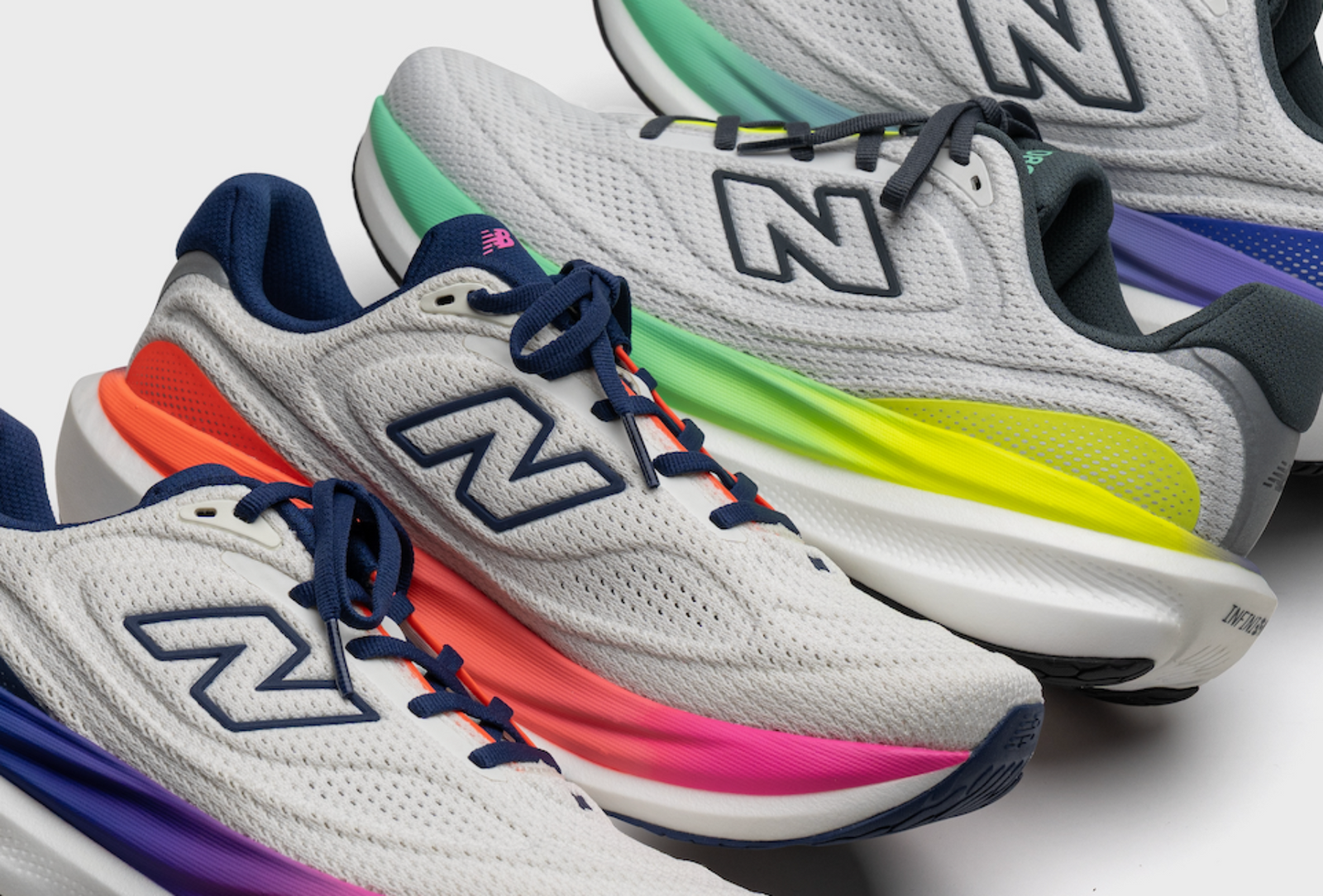 New Balance 1080v15 running shoes in four gradient colorways arranged in a diagonal banner layout on a white background close up