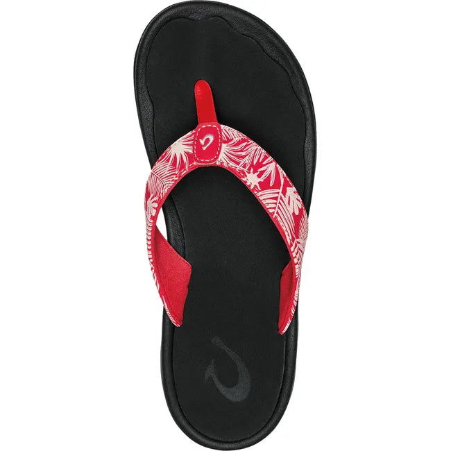 Top down view of Women&#39;s Olukai Ohana Flip Flop with Lehua Flower Red upper and Black sole