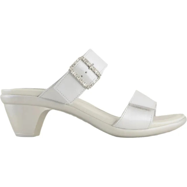 Lateral side view of a single Naot Women's Recent slide heel sandal in white pearl leather, showing no backstrap for easy slip on, jeweled buckle on padded instep strap, and hook-and-loop velcro feature on both straps.