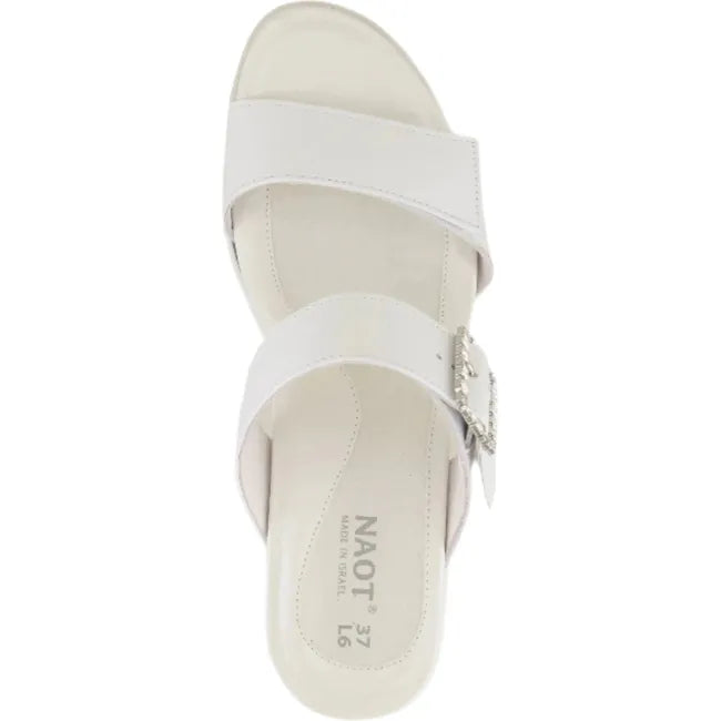 Top view of a single Naot Women's Recent slide heel sandal in white pearl leather, showing no backstrap for easy slip on, jeweled buckle on padded instep strap, and hook-and-loop velcro feature on both straps.