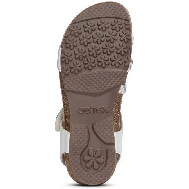 Brown sole of Women's Aetrex Jillian Arch Support Sandal in white upper