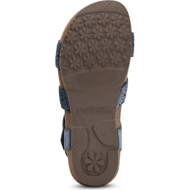 Brown sole of Women's Aetrex Lilly Arch Support Sandal in Navy Cutout leather upper