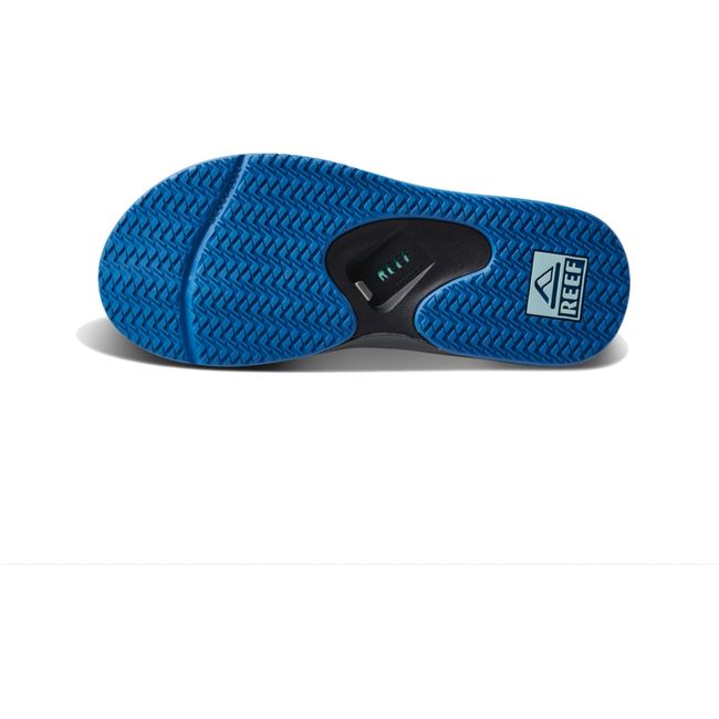 Sole of Mens Reef Fanning Flip Flop in gunmental ocean gray and blue with bottle opener