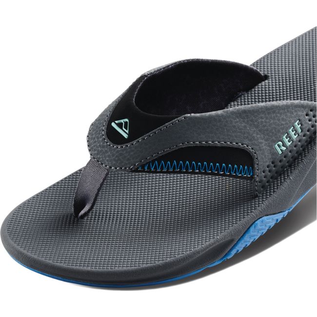 CLose up of Men's Reef Fanning Bottle Opener Flip Flop in gunmental ocean gray