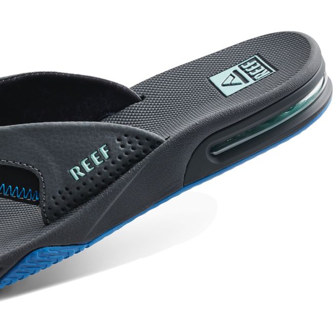 Heel close up of Men's Reef Fanning Bottle Opener Flip Flop in gunmental ocean gray