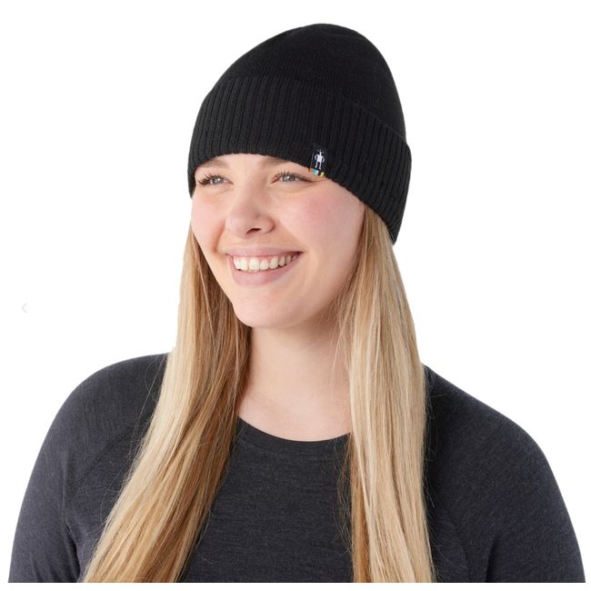 Girl with blonde hair wearing black Smartwool Unisex Fleece Lined Beanie
