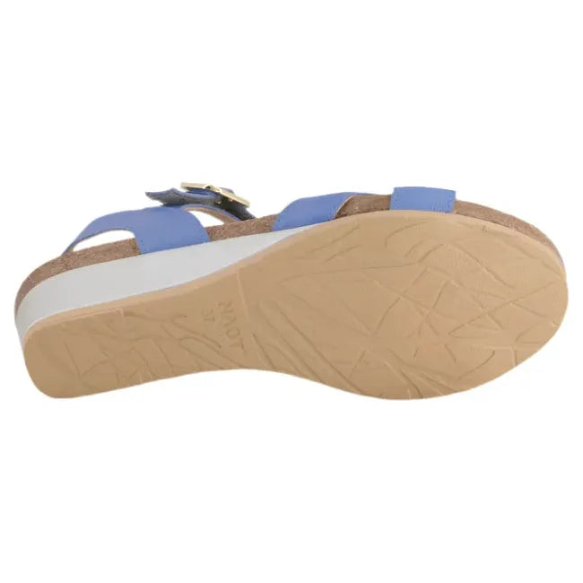 Sole view of Naot Women's Throne Wedge Sandal, highlighting the silver-colored wedge piece and tan sole with shallow tread for lightweight comfort.