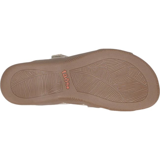 Tan sole of Women&#39;s Taos Double U Slide Sandal in Champagne leather upper